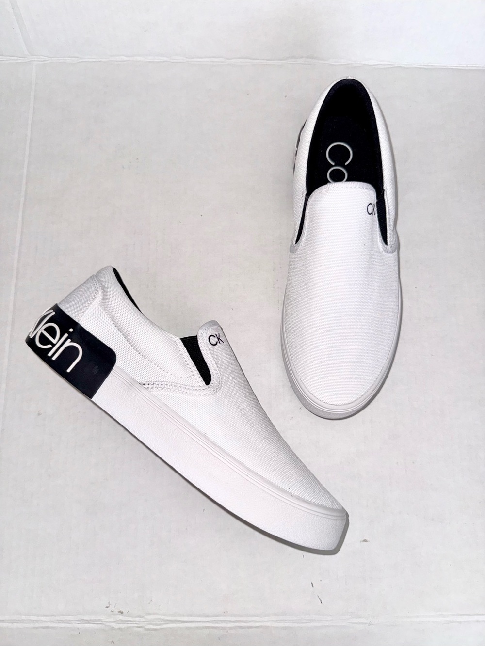 Calvin Klein White Canvas Slip-On Loafers with Black Heel Logo Accent